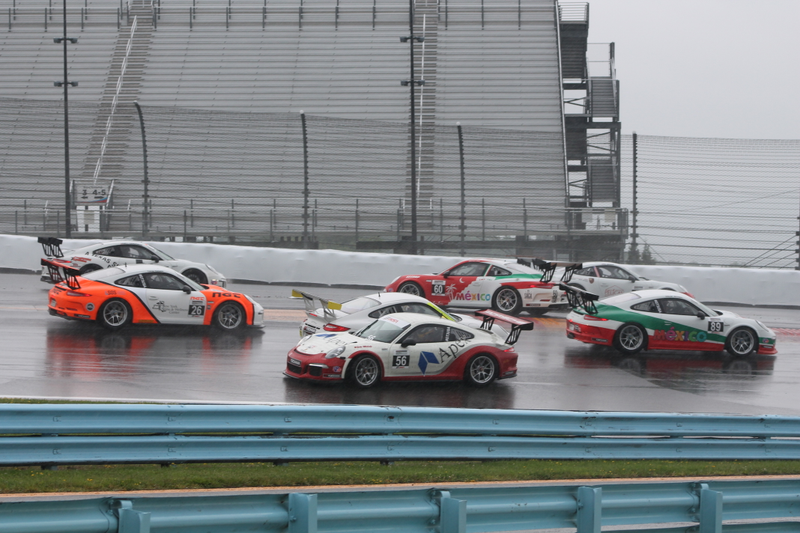 Illustration for article titled Standing Water Causes Mass 911 GT3 Cup Spin-Out At First Turn Of Race